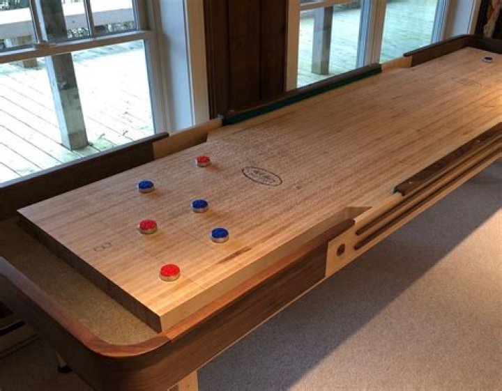 Shuffleboard sand changes how puck moves